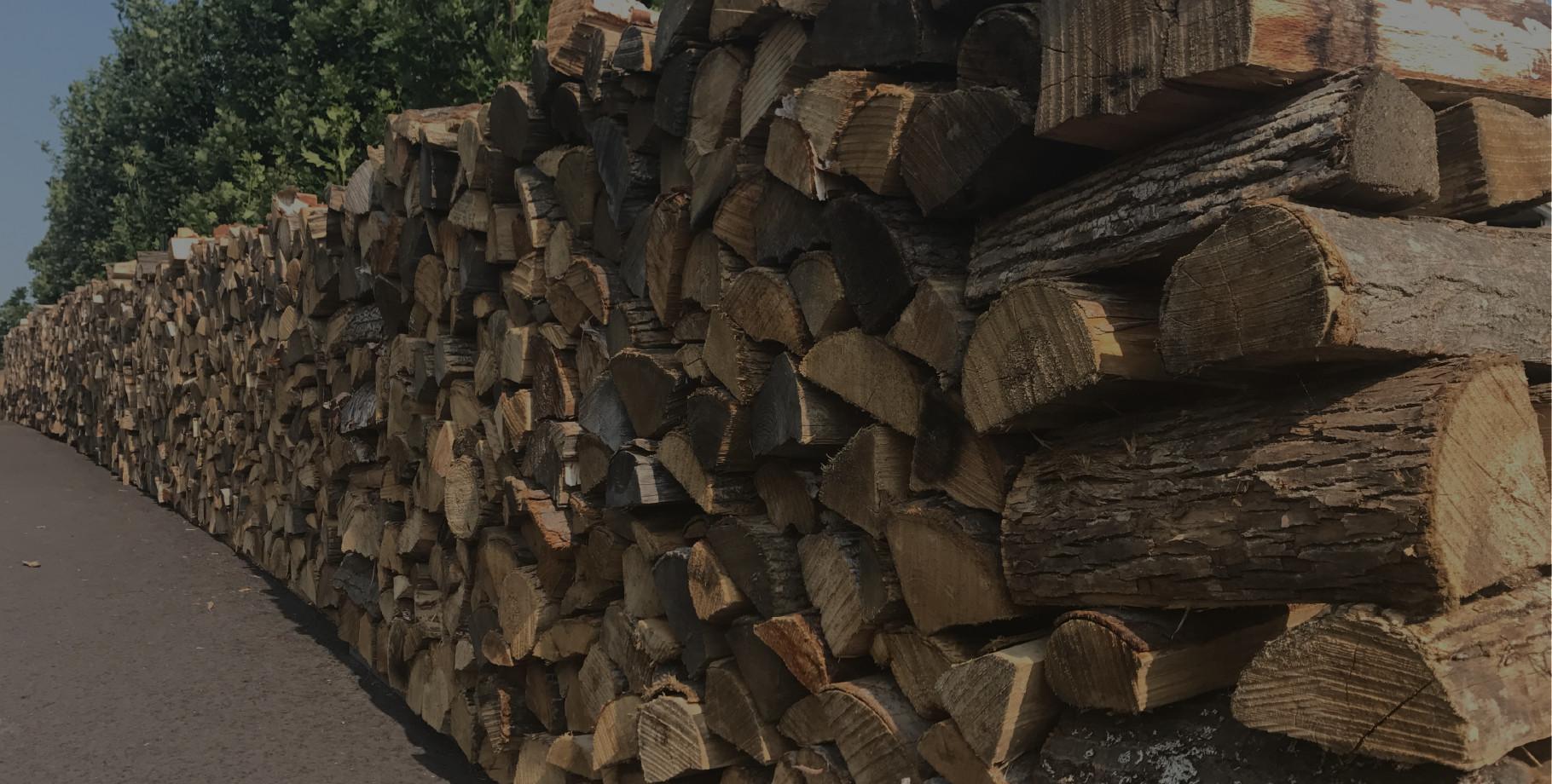 Rows of stacked seasoned hardwood firewood
